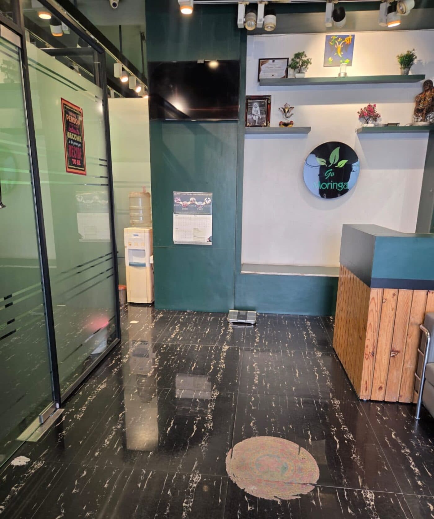 Reception area of Go Moringa Diet Clinic — Sector 49 Gurugram, with the Go Moringa logo on the wall